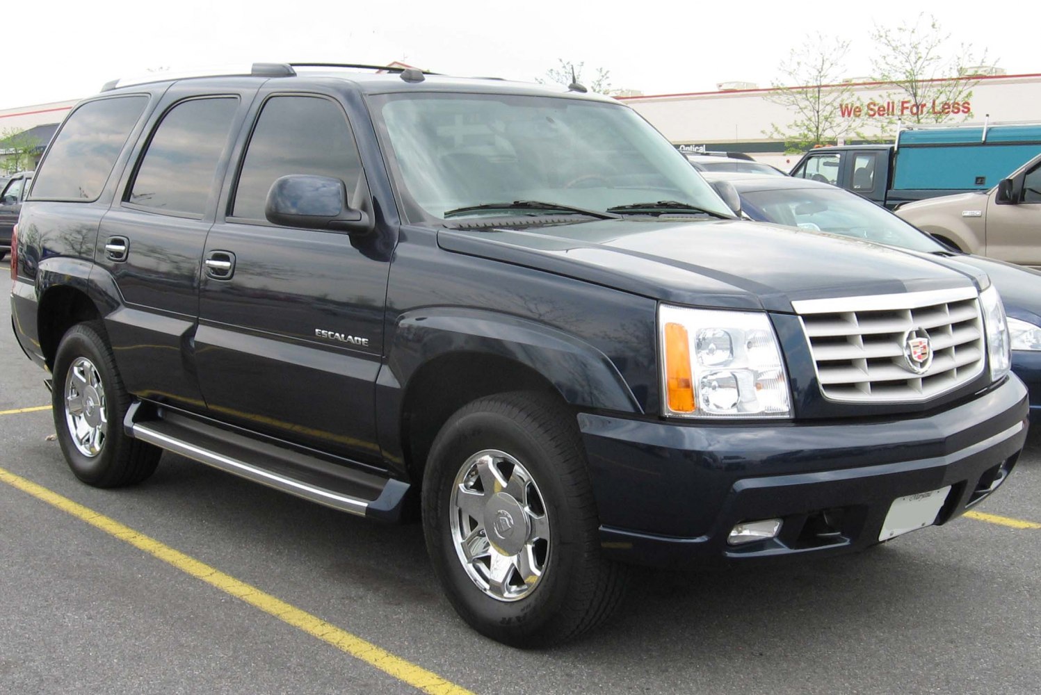 Large SUV with prominent front grille and chrome wheels
