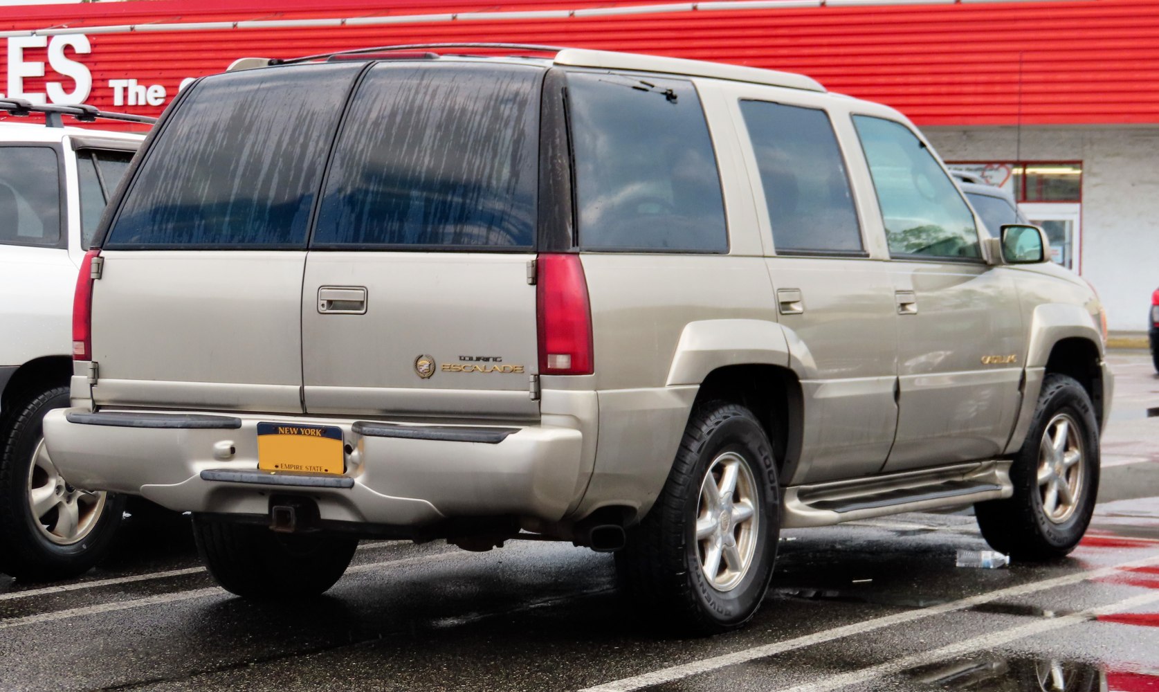 Rear and side view of SUV with tinted windows and alloy wheels