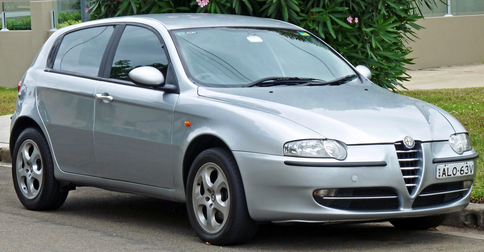 Silver hatchback with distinct grille and alloy wheels front side view