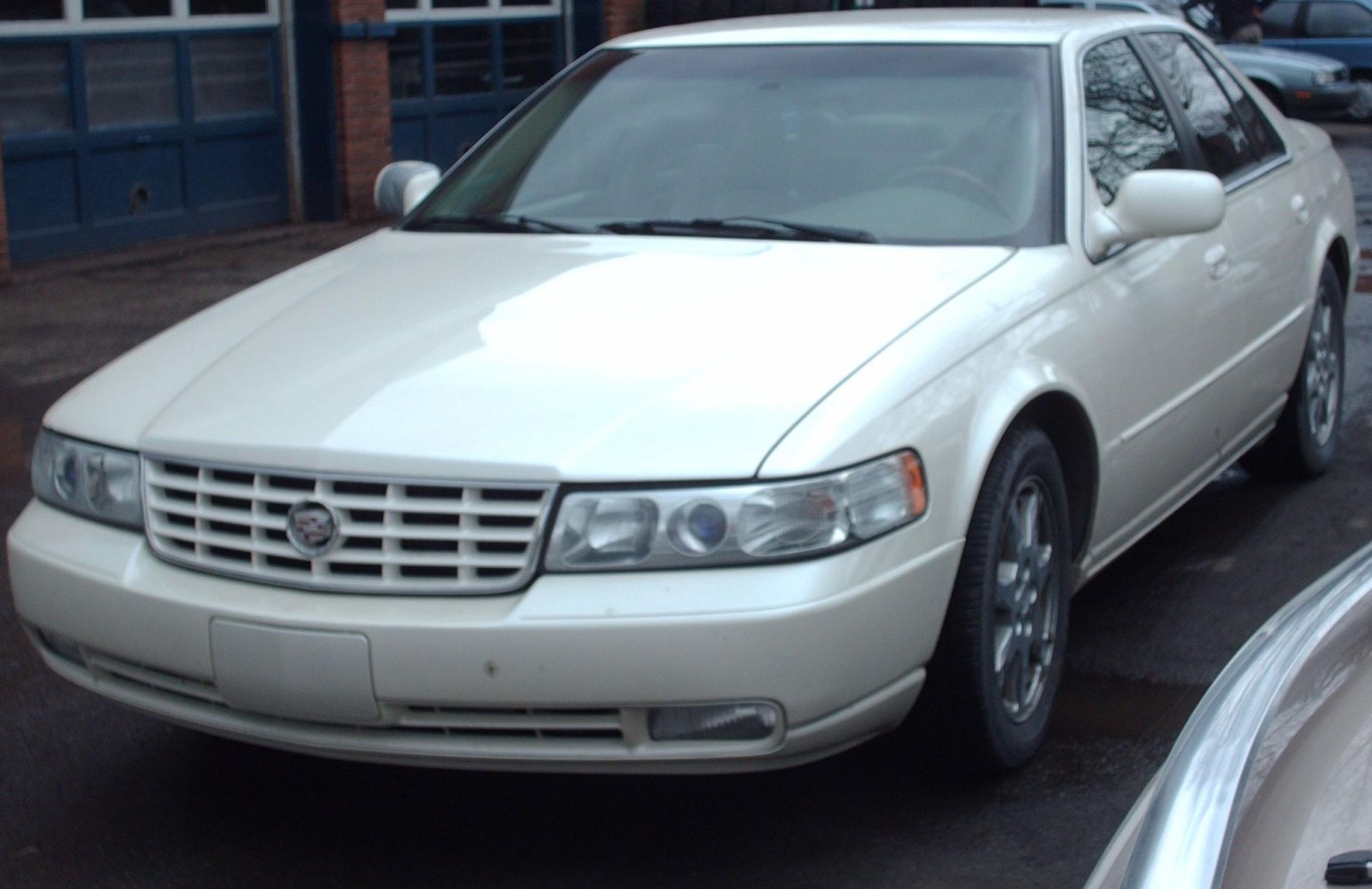 Front view showing horizontal grille, multi-segment headlights, and fog lights