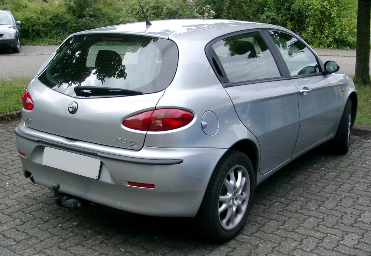 Rear view of 5-door hatchback with distinct oval tail lights and rear hatch