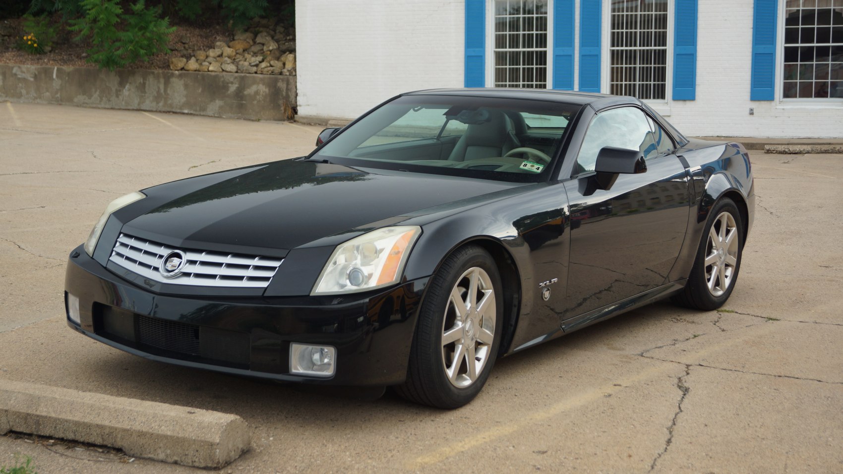 Luxury sports coupe with front grille and alloy wheels
