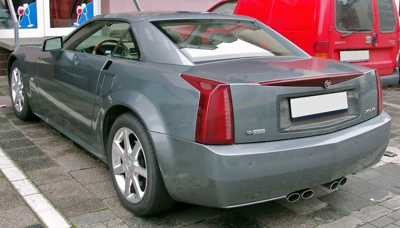 Rear view with quad exhaust, distinct vertical tail lights