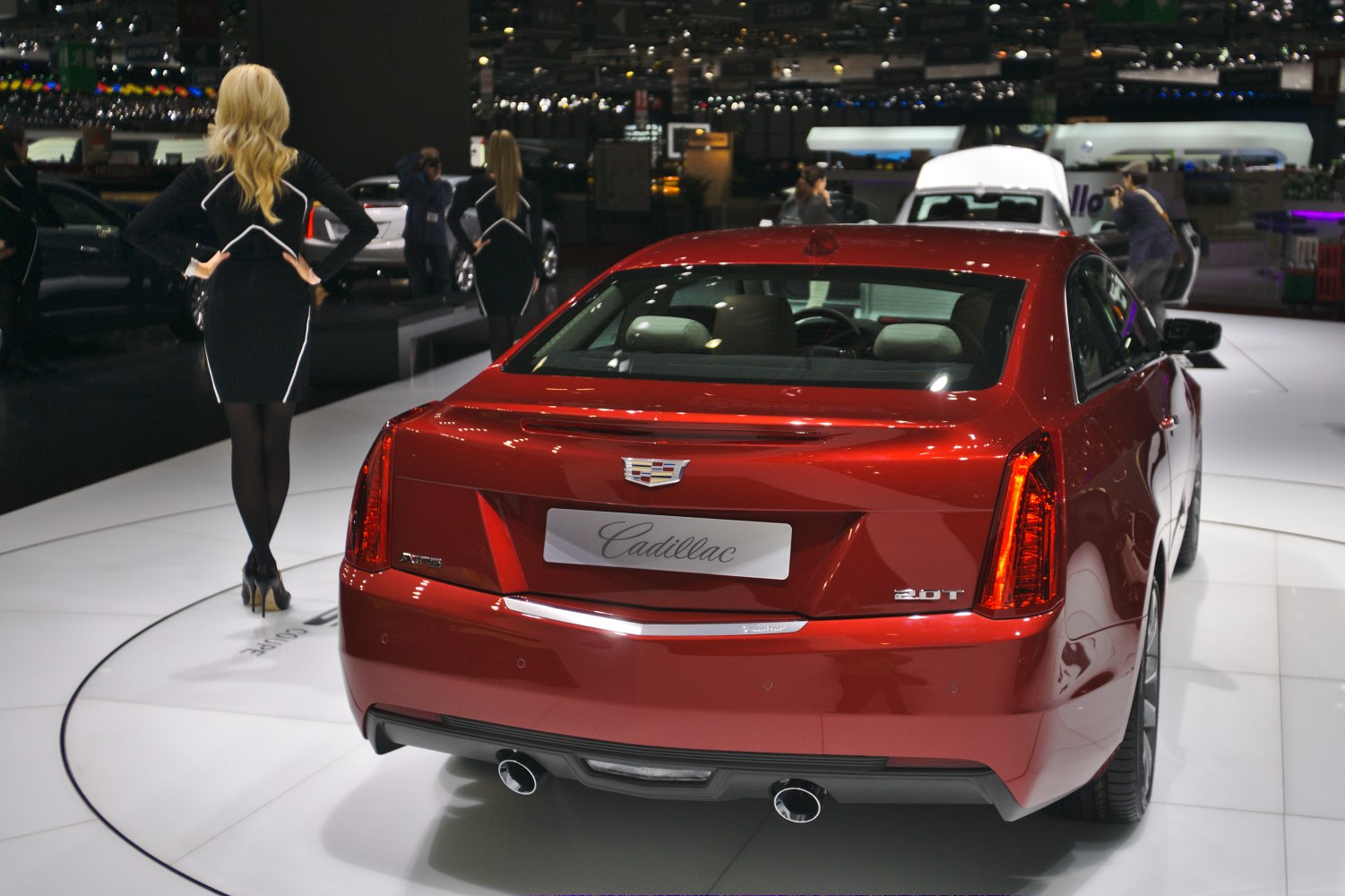 Rear view of luxury coupe with dual exhaust and vertical LED taillights