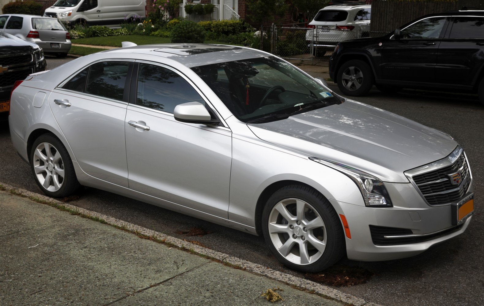 Silver mid-size sedan with alloy wheels and sunroof
