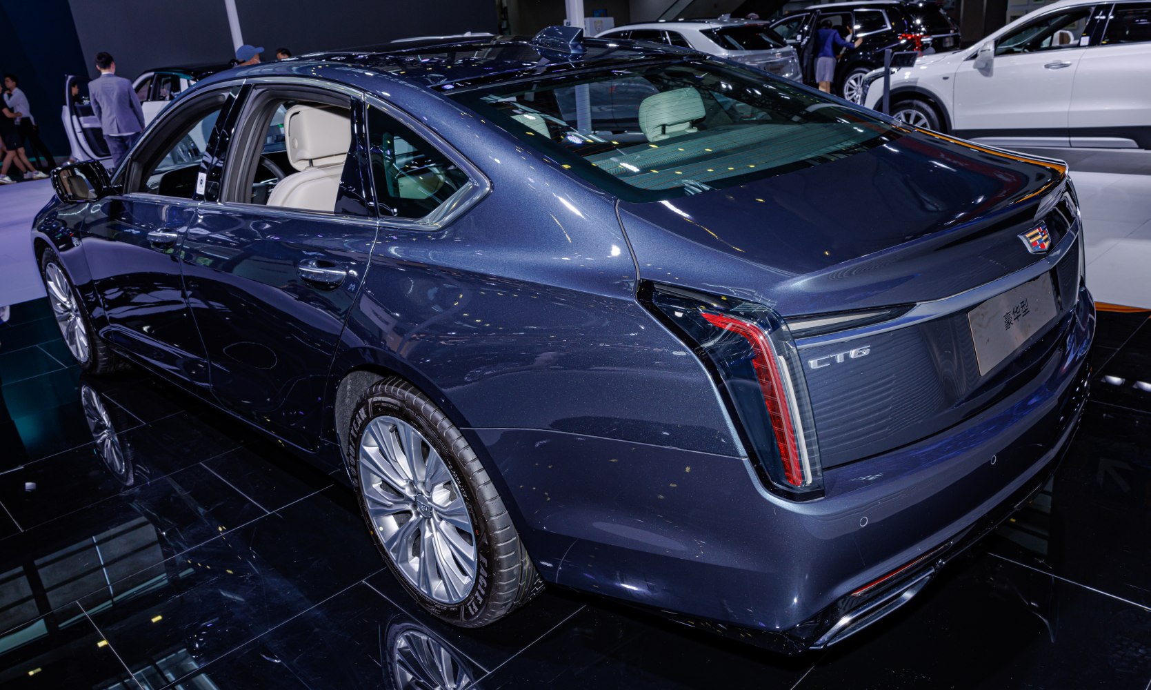 Rear-side view of luxury sedan with distinctive vertical taillights