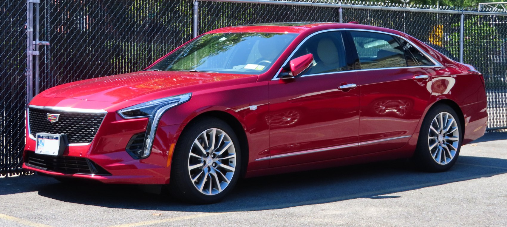 Sleek sedan with vertical LED headlights and multi-spoke alloy wheels