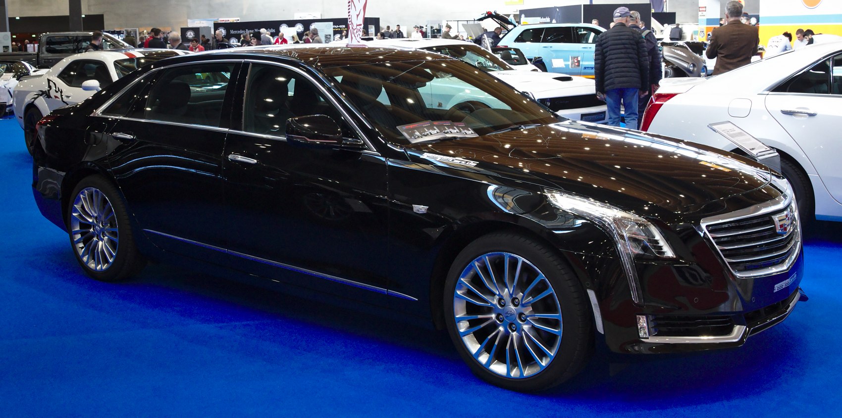Black luxury sedan with chrome grille and stylish alloy wheels