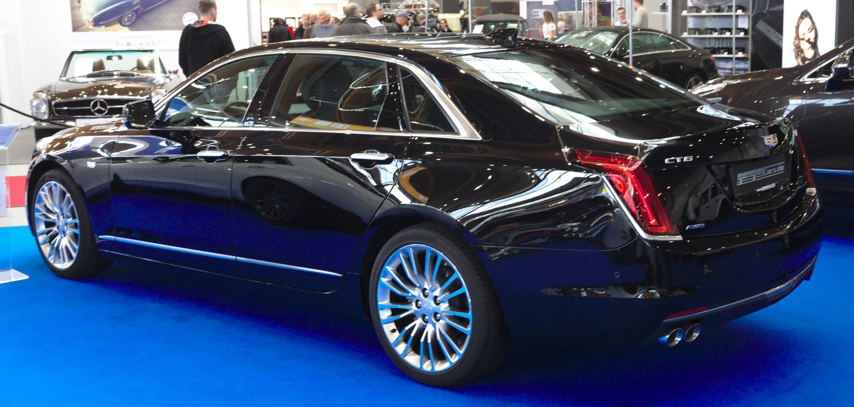 Rear side view with vertical taillights and alloy wheels
