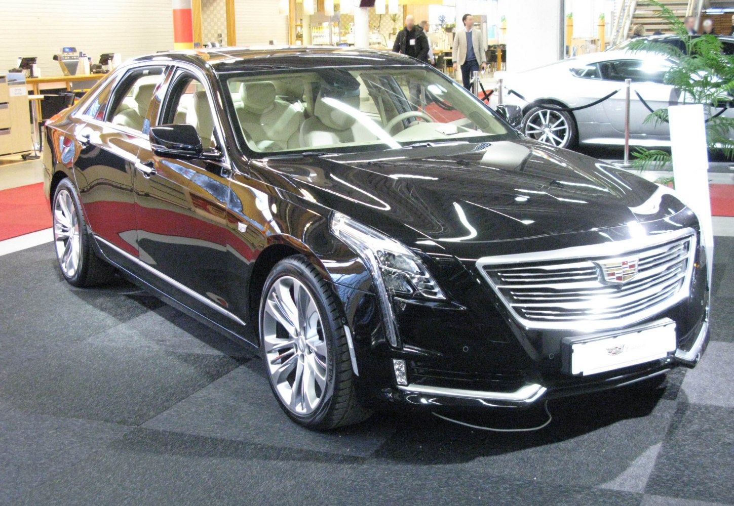 Black sedan with chrome grille and LED headlights
