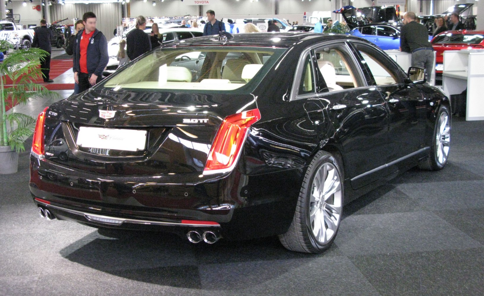 Rear view showing 3.0TT badge, quad exhaust, LED tail lights