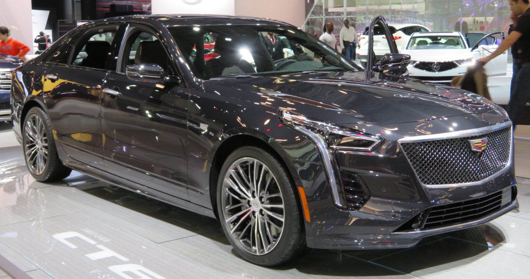 Luxury sedan front with mesh grille and vertical LED headlights
