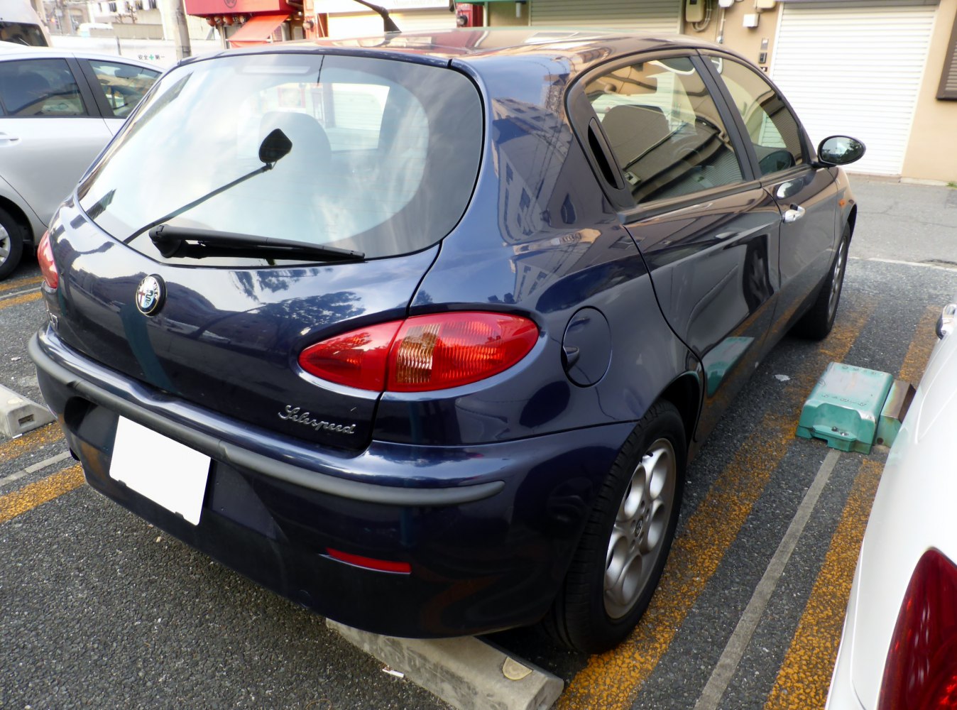 Rear and side view of a 5-door hatchback with distinct tail lights and curved body lines