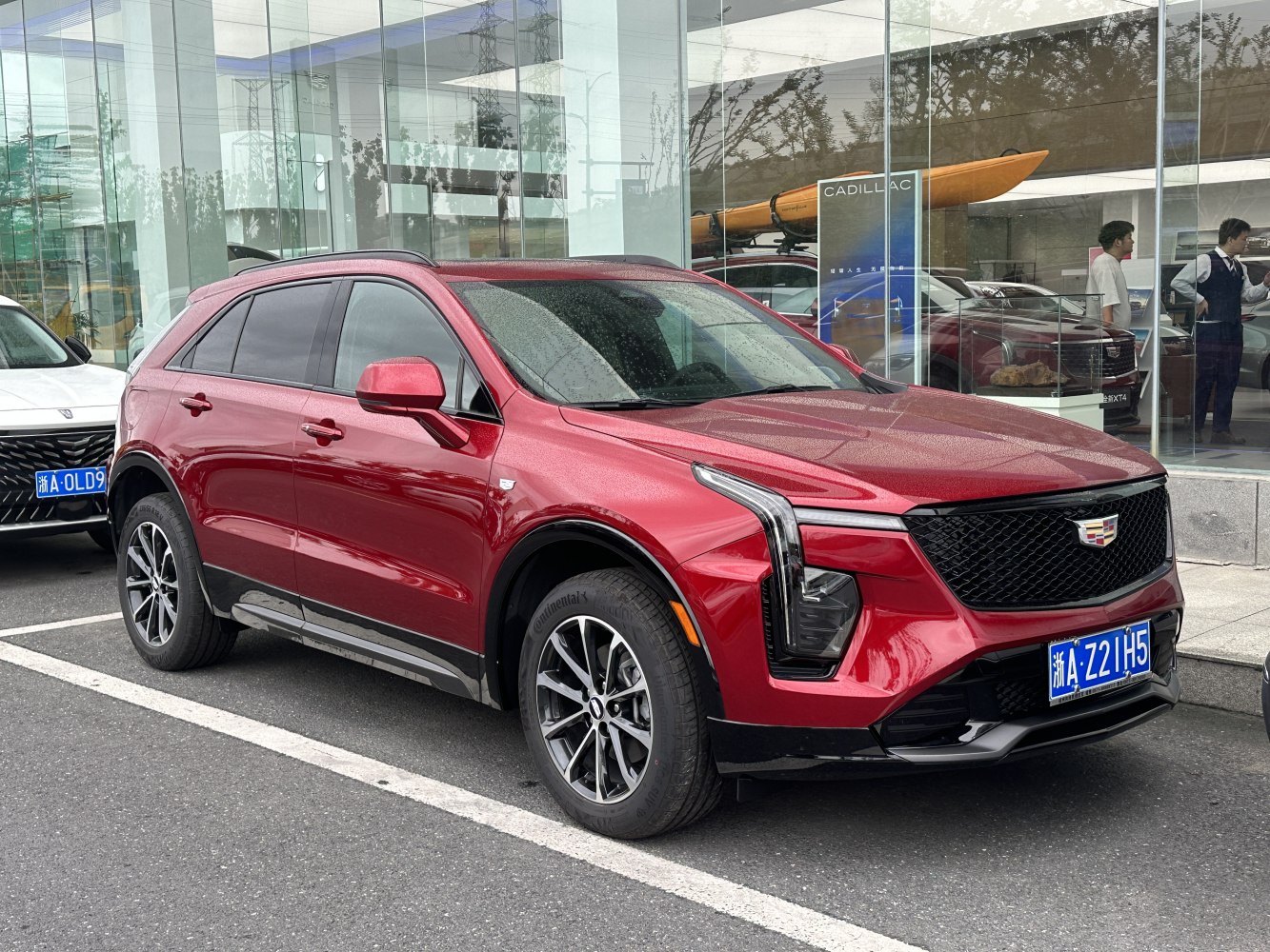 Red 2024 facelifted luxury SUV with LED headlights and bold grille