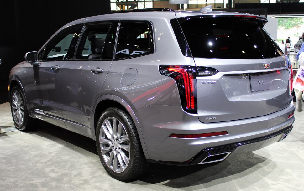 Rear and side exterior view of a luxury SUV highlighting AWD and tail light design.