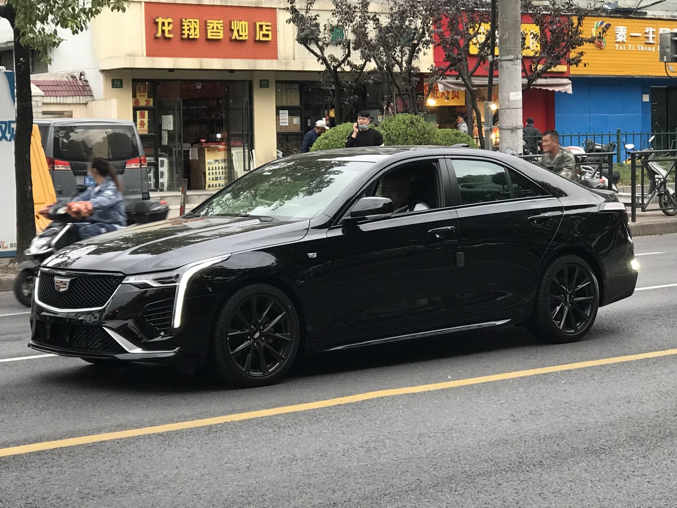 Luxury sedan with vertical LED lights and black alloy wheels