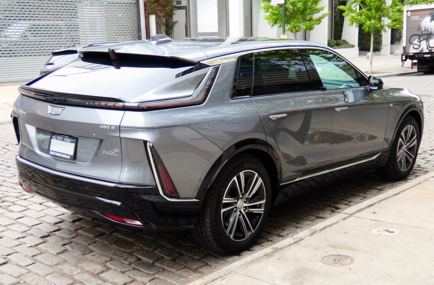 Electric SUV rear with taillight bar and alloy wheels