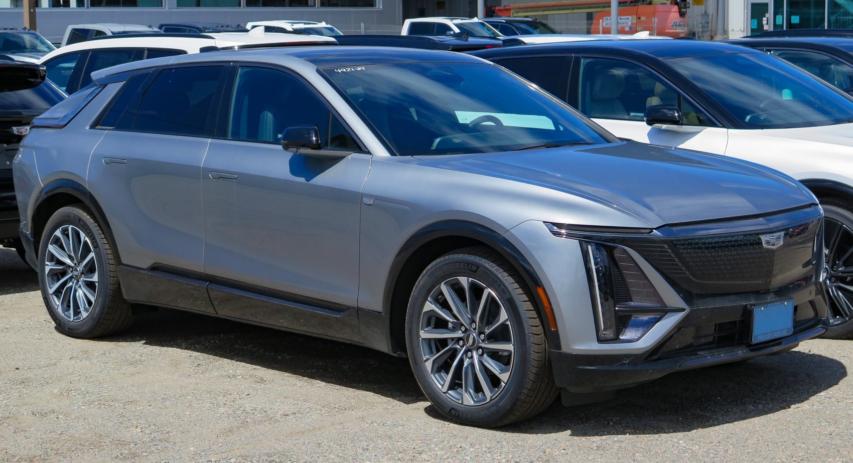 Front side view of modern electric SUV with LED headlights and sleek design