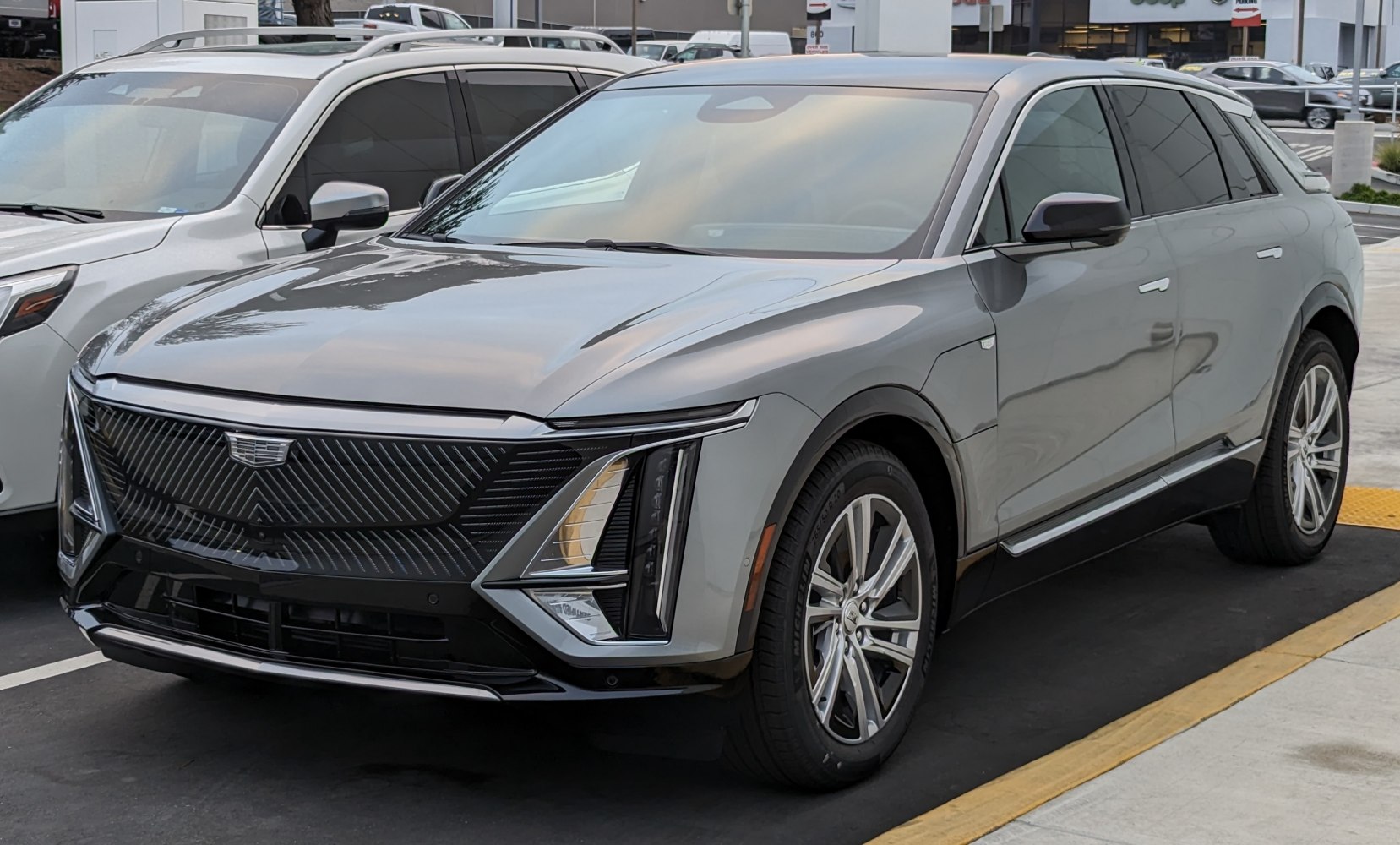 Electric SUV with a futuristic front grille and vertical LED headlights