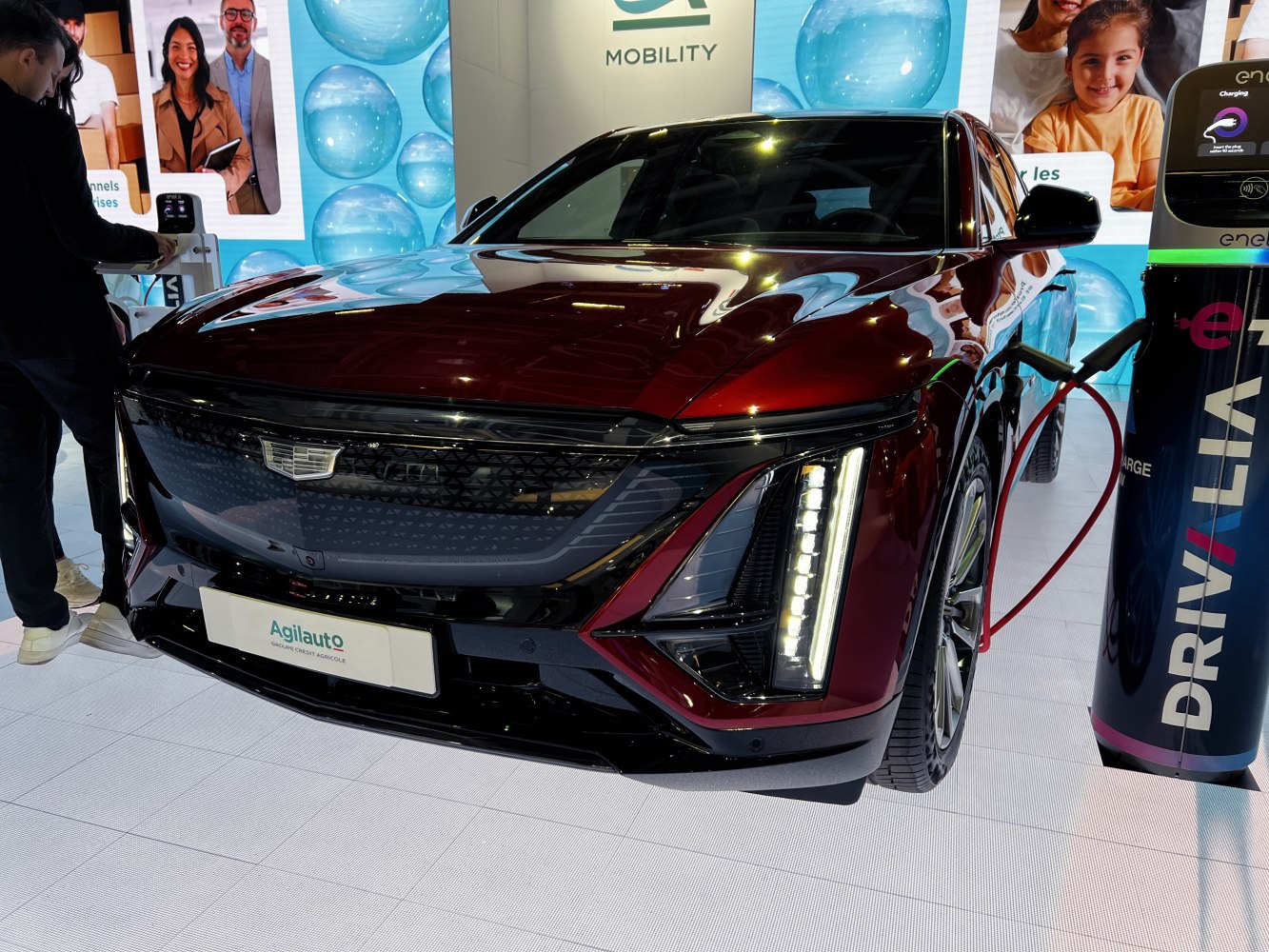 Electric SUV front view showing charging connection and vertical LED headlights