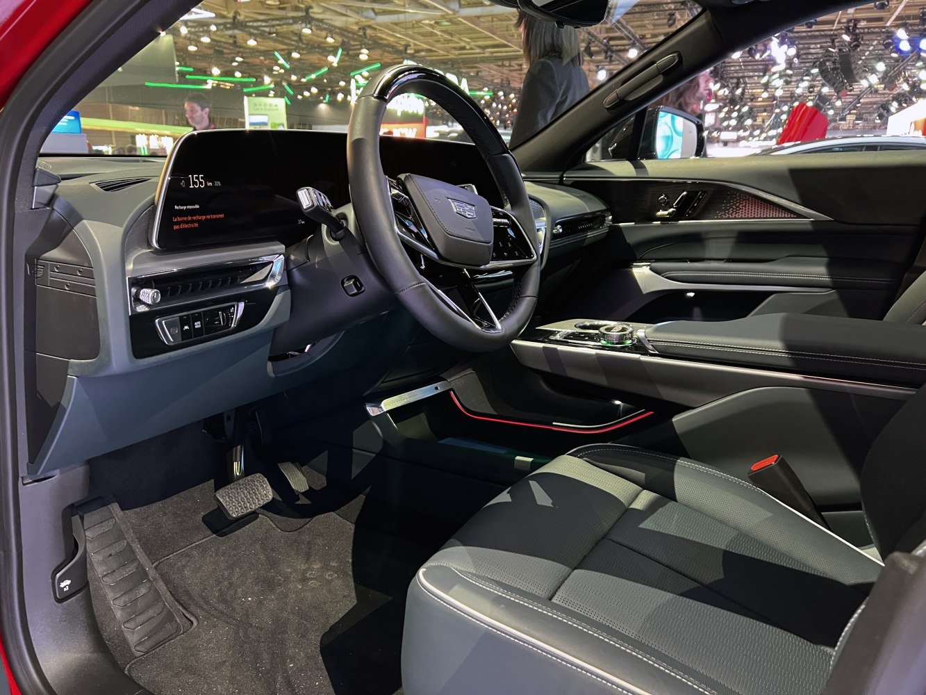 Digital dashboard and modern steering wheel in a luxury vehicle interior