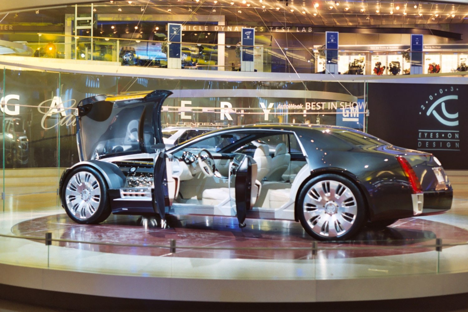 Luxury vehicle with gullwing doors and exposed engine bay