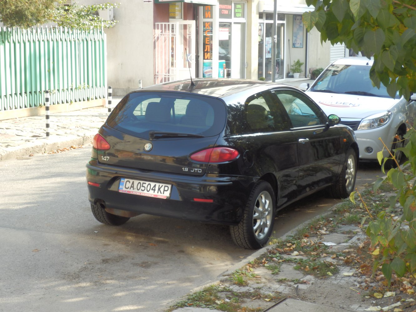 Rear view of 3-door hatchback with distinctive tail lights and alloy wheels