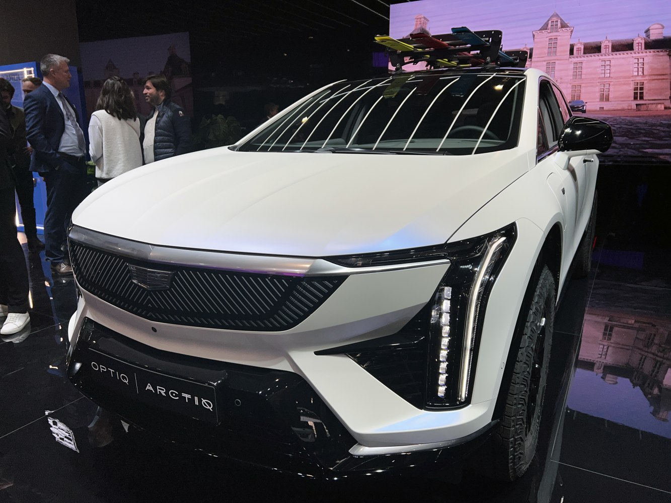 Front view of SUV with vertical LED headlights and roof rack