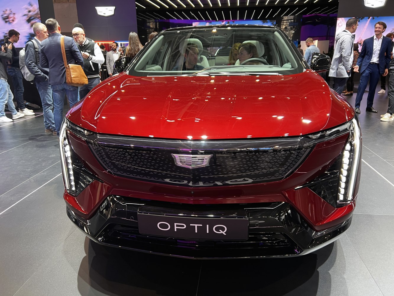 Front view with distinctive LED headlights and modern grille