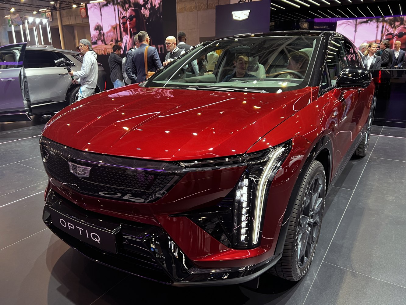 Bold front grille and vertical LED headlights on a red SUV