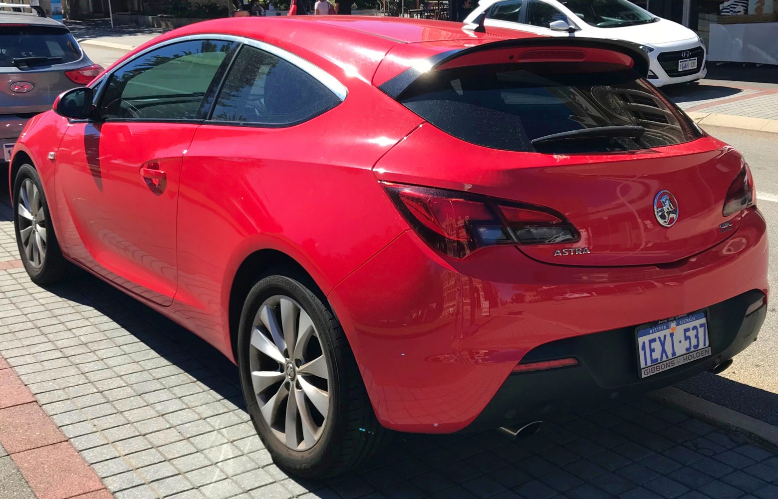 Sporty hatchback rear side with taillights and spoiler