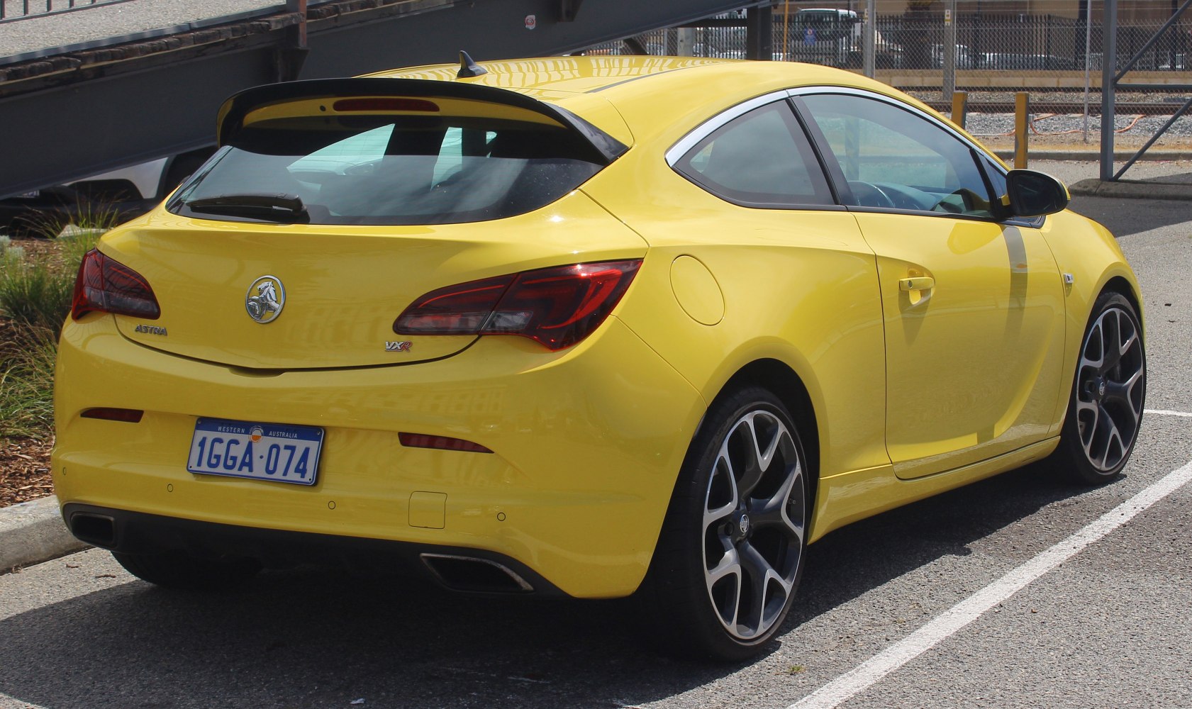 Sporty hatchback rear with twin exhausts and sleek taillights