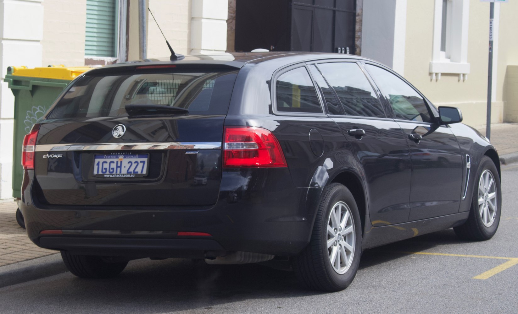 Rear view of a station wagon with distinctive tail lights and rear hatch.