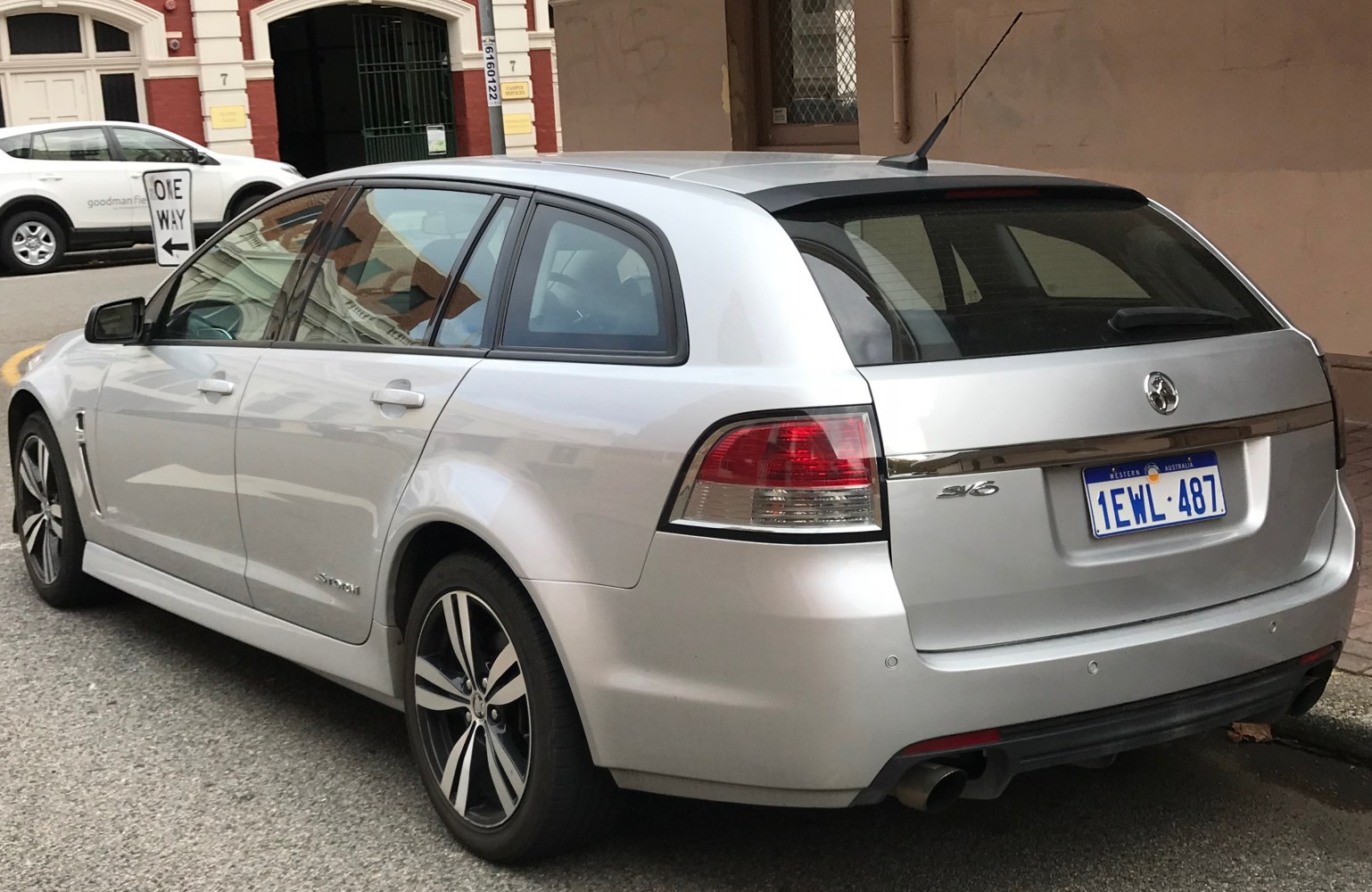Silver station wagon with rear side view, alloy wheels, and distinct taillights