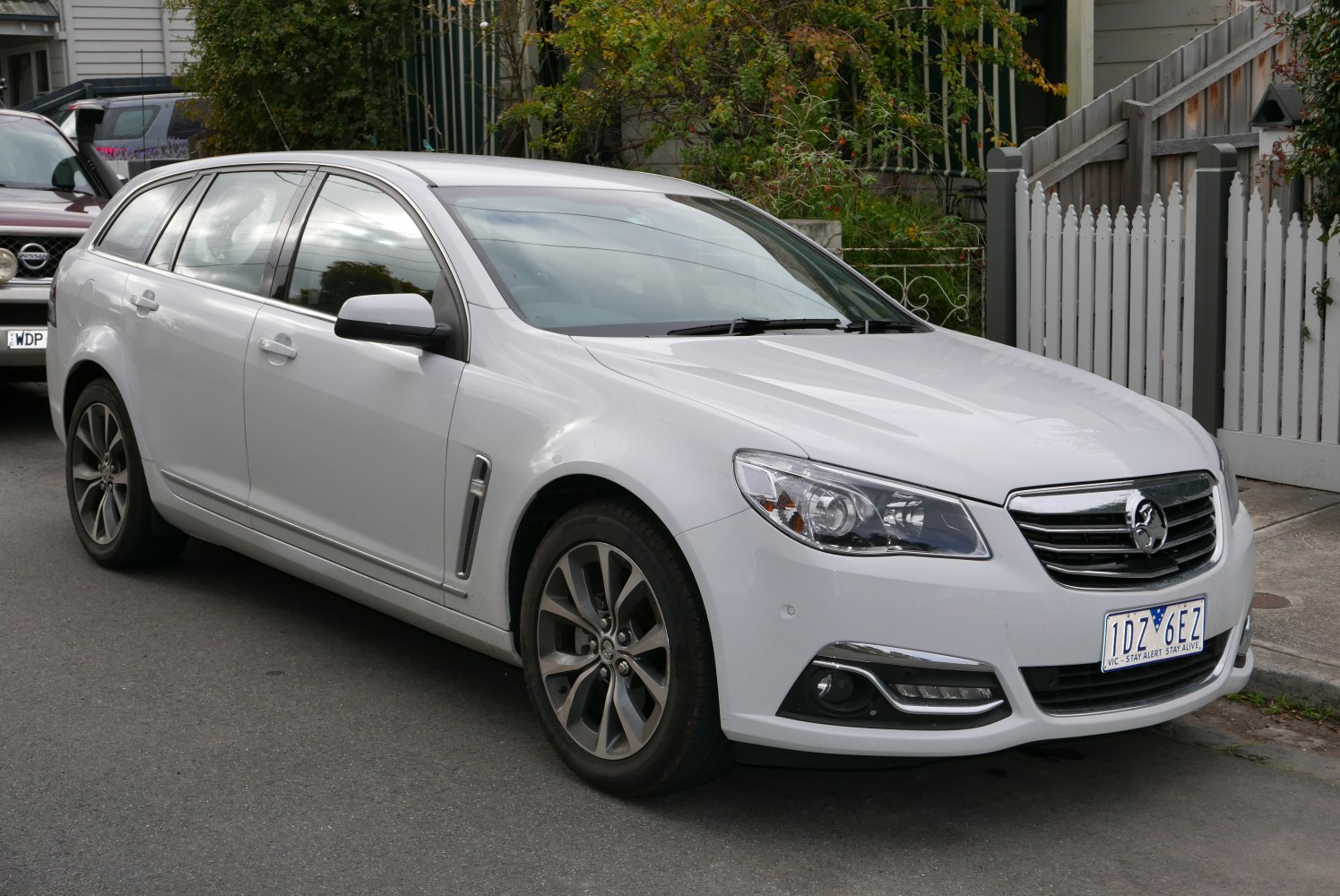 White sports wagon with alloy wheels and chrome grille trim