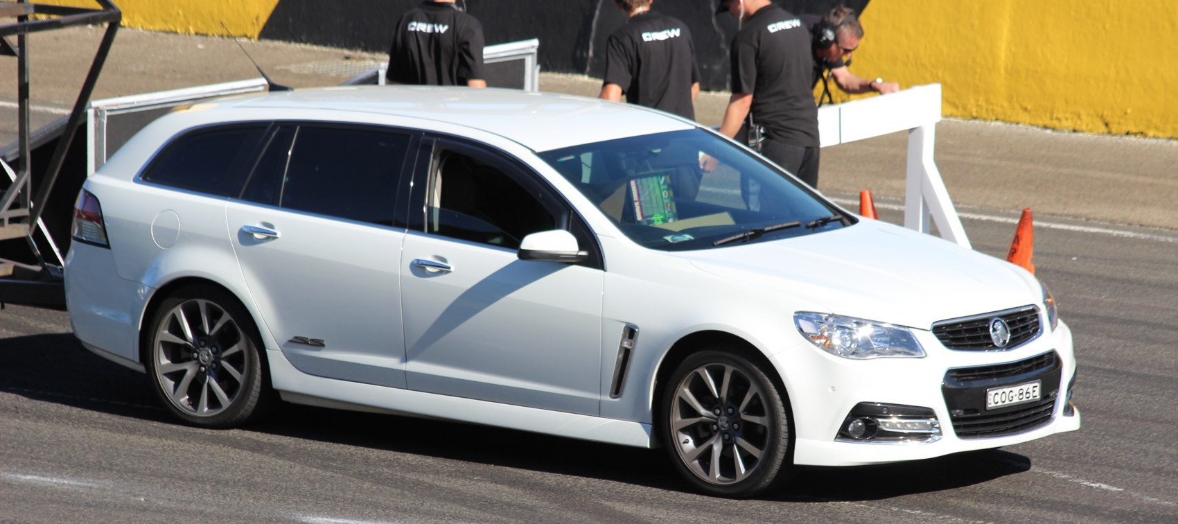 White station wagon with alloy wheels and front bumper details
