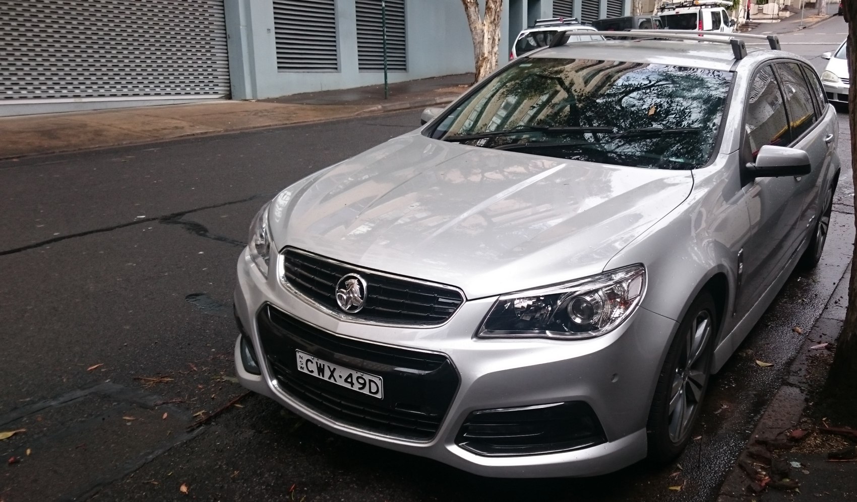 Silver station wagon with distinct front grille and headlights