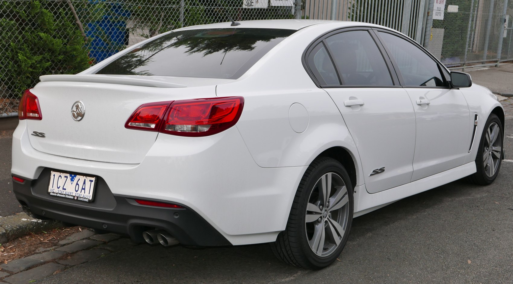 Rear and side of sedan with SS badge and dual exhausts