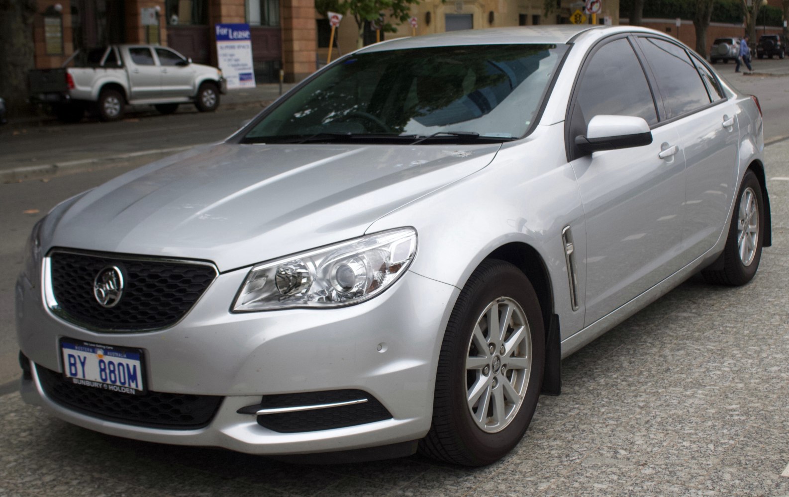 Silver sedan with sleek grille and modern headlights shown from the front angle