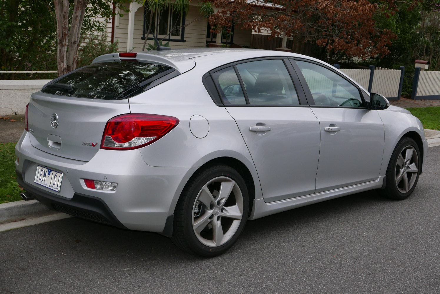 Silver modern hatchback rear and side view with distinctive tail lights and alloy wheels