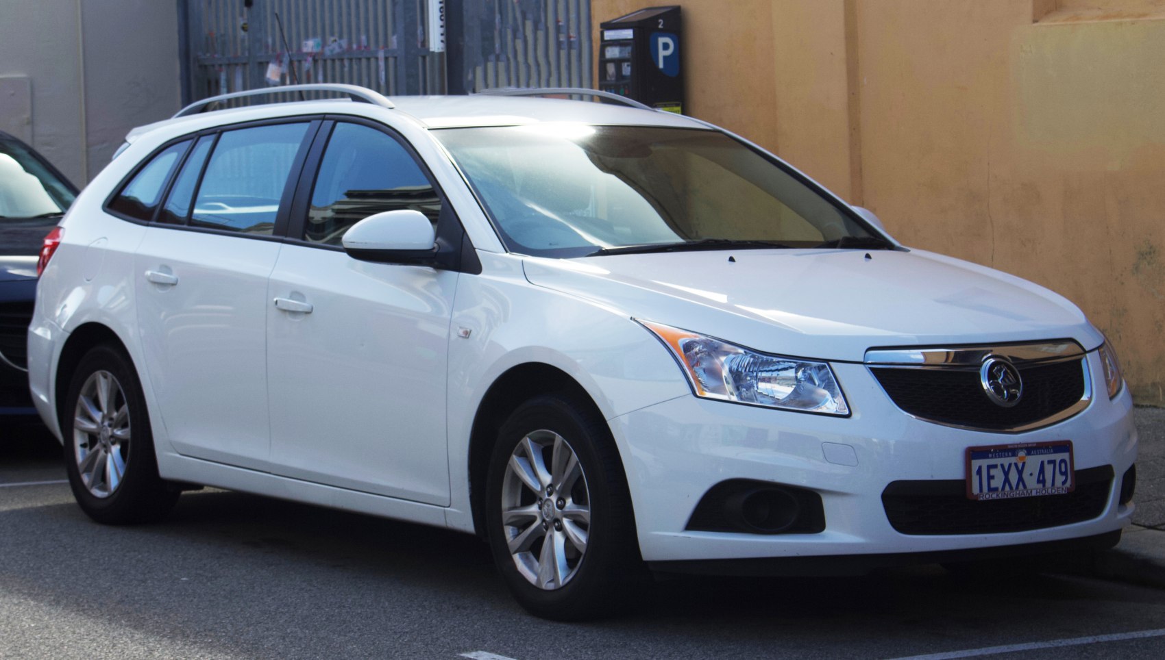 White station wagon showing front and side profile
