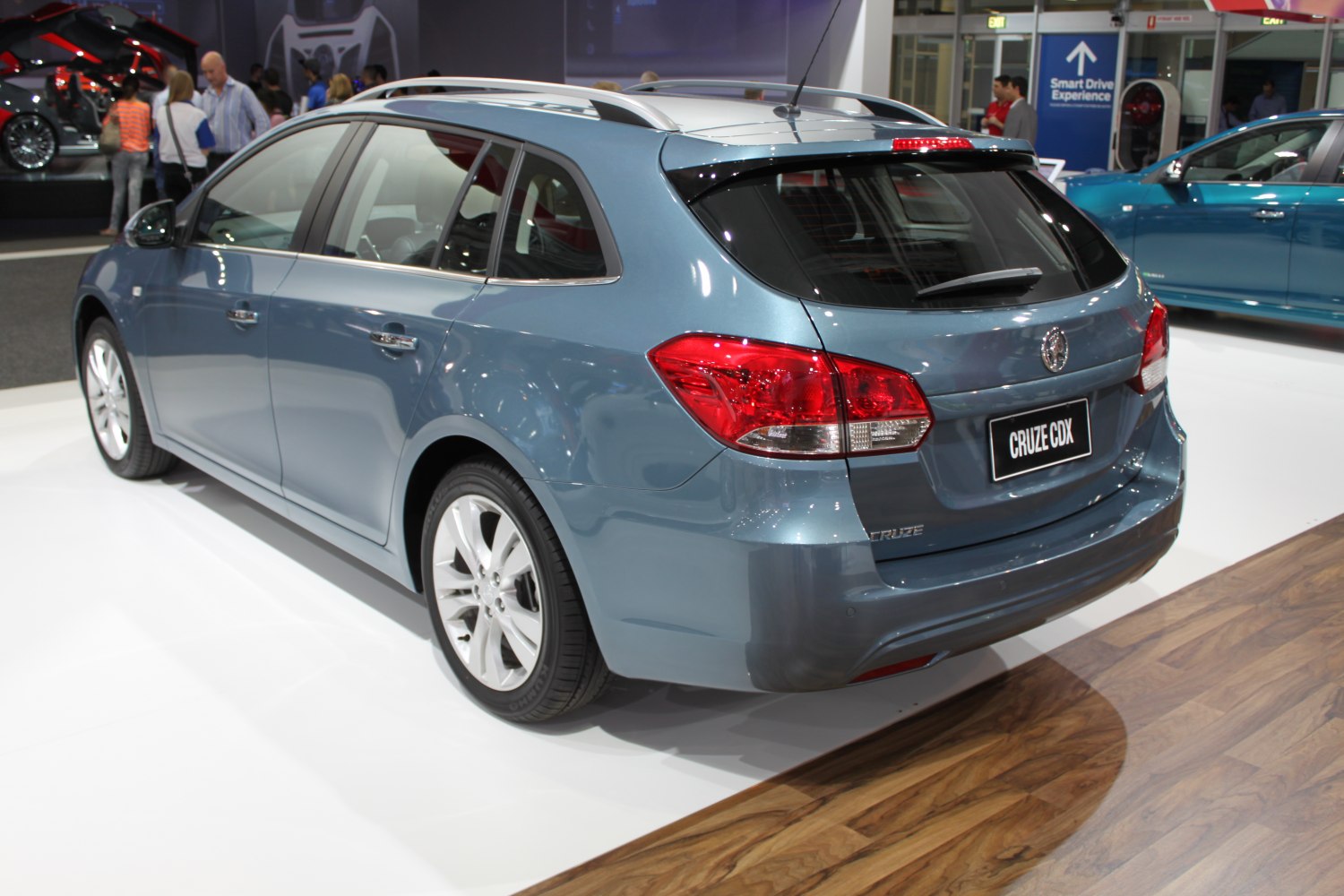 Rear and side view of a 2013 wagon with roof rails and distinct tail lights