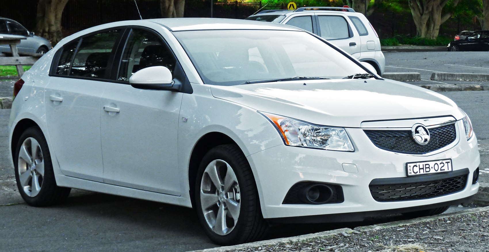White hatchback with alloy wheels and front grille