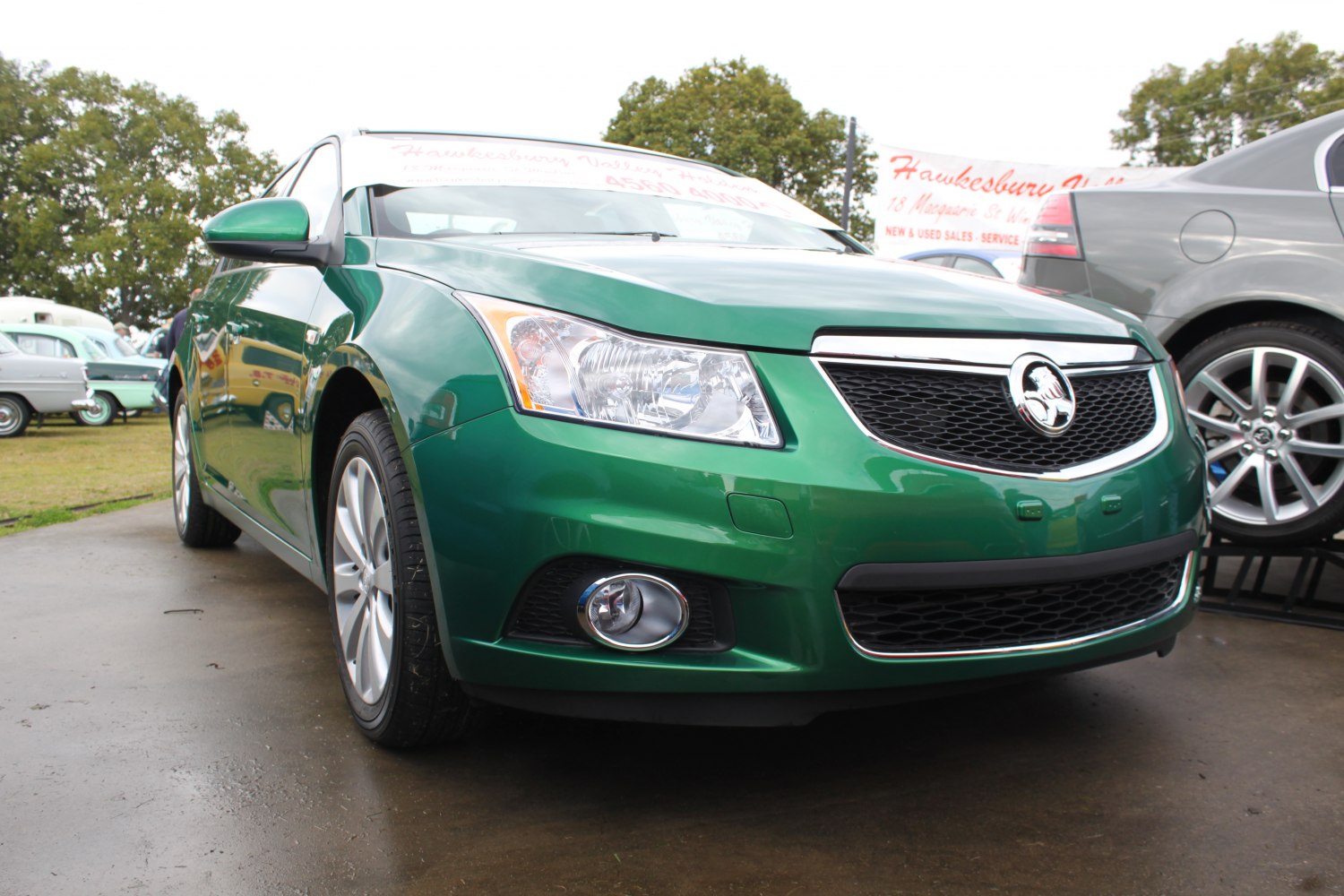Front view with grille, headlight, and fog light of a sedan