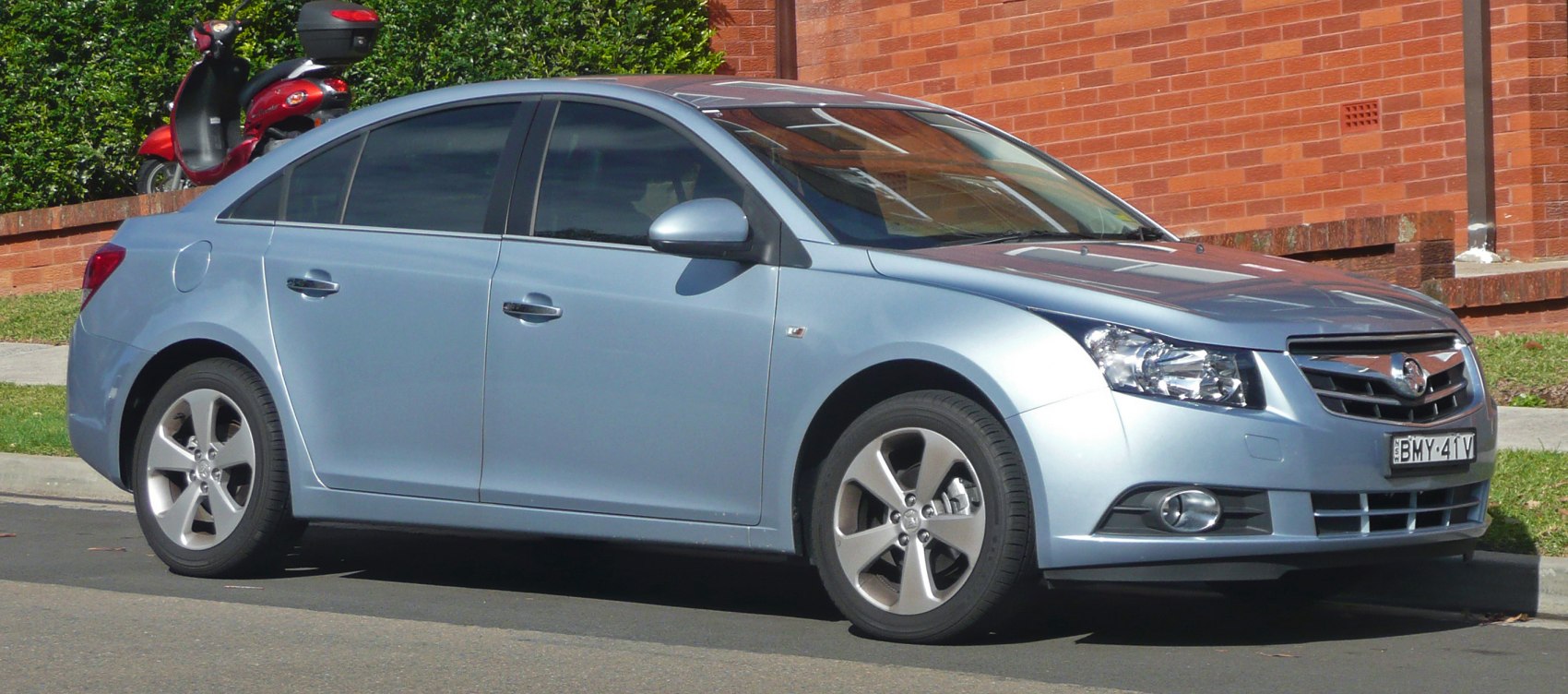 Front side view of a silver four-door sedan with alloy wheels