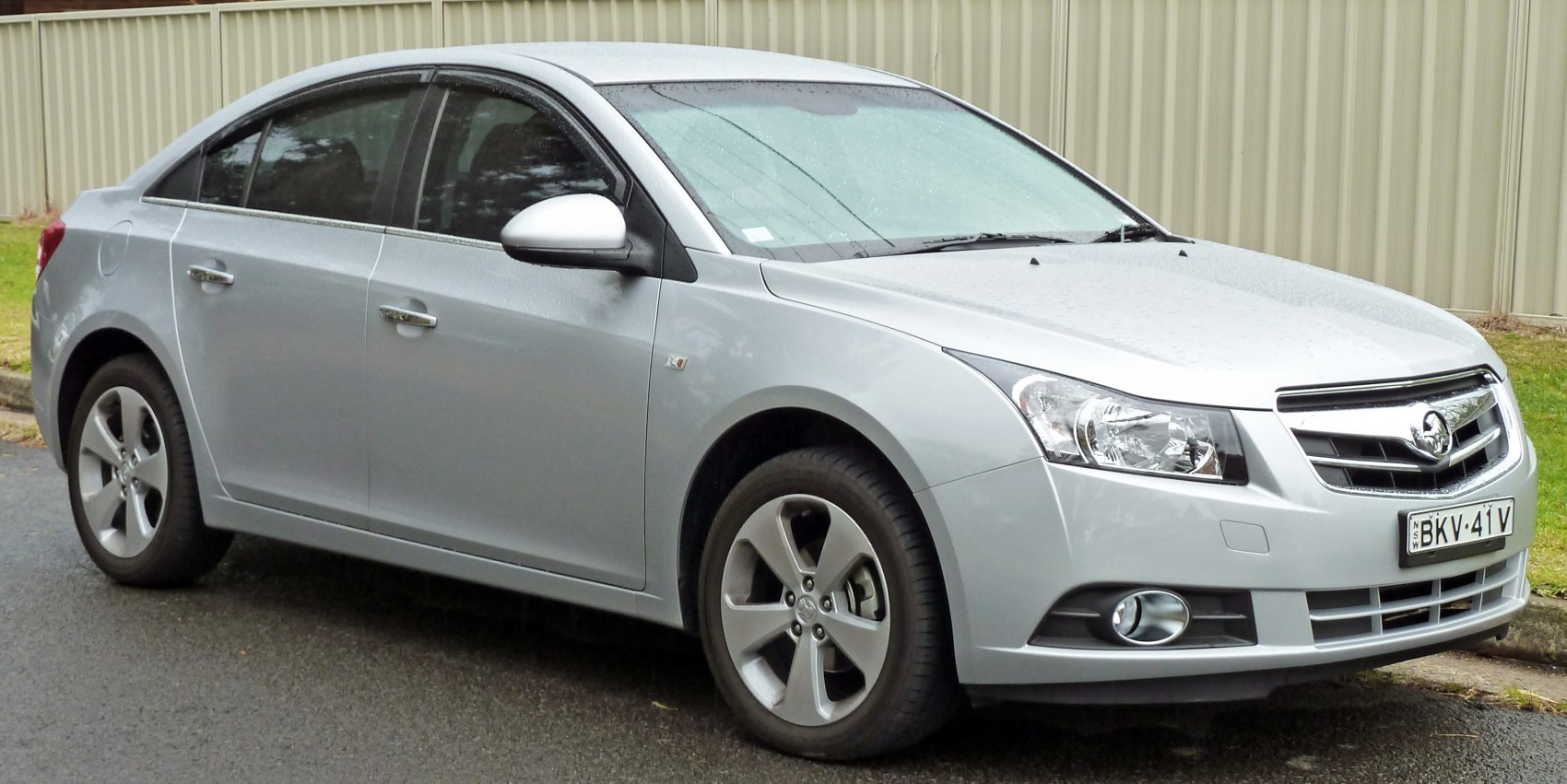 Silver mid-size sedan with alloy wheels and fog lights