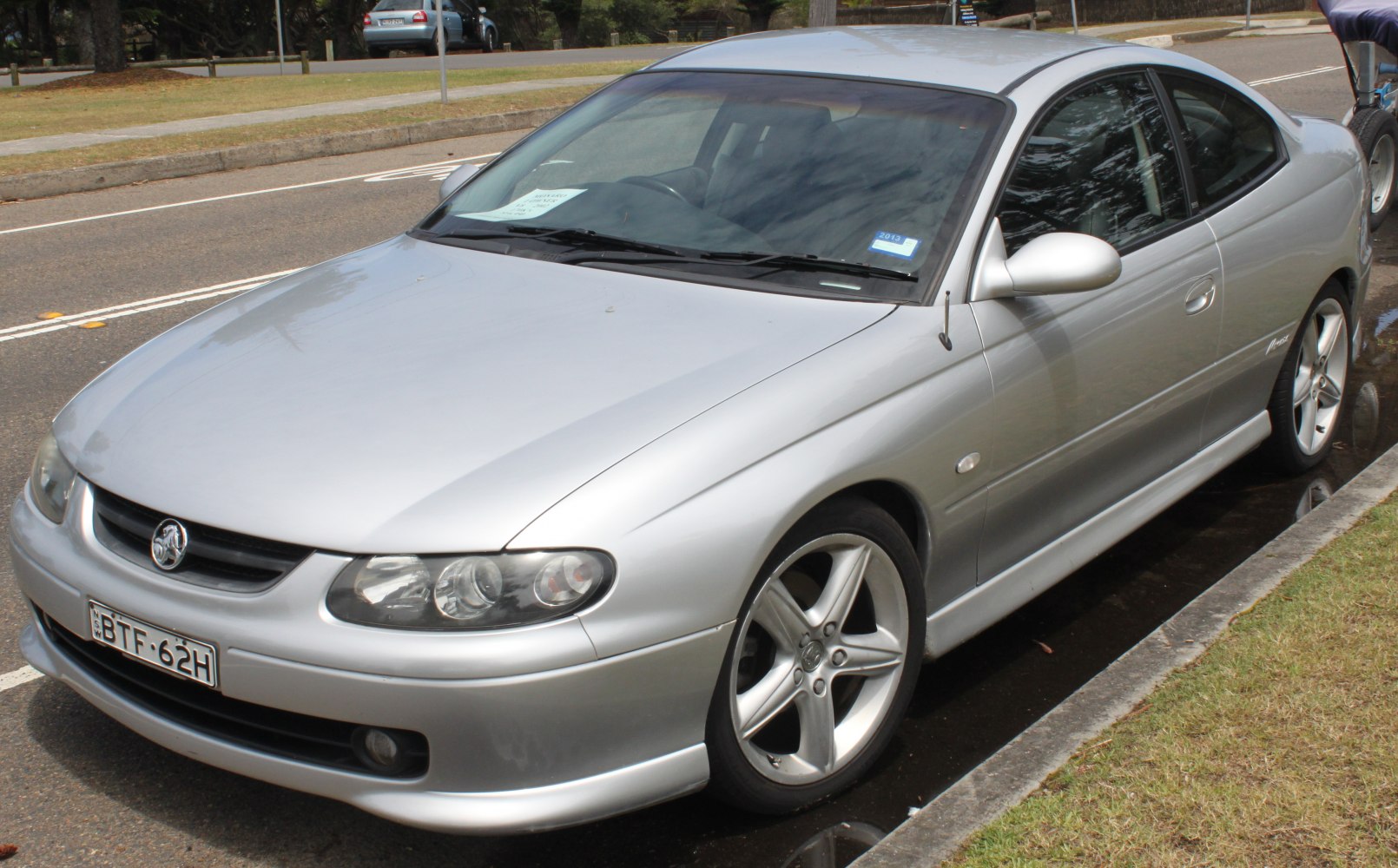 Silver coupe with alloy wheels and aerodynamic shape