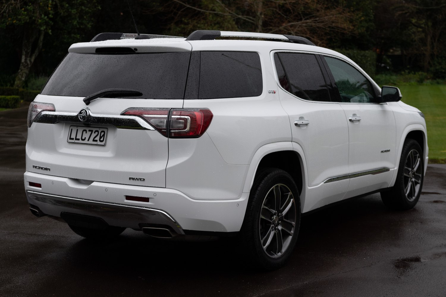 Modern SUV rear with chrome trim and dual exhaust