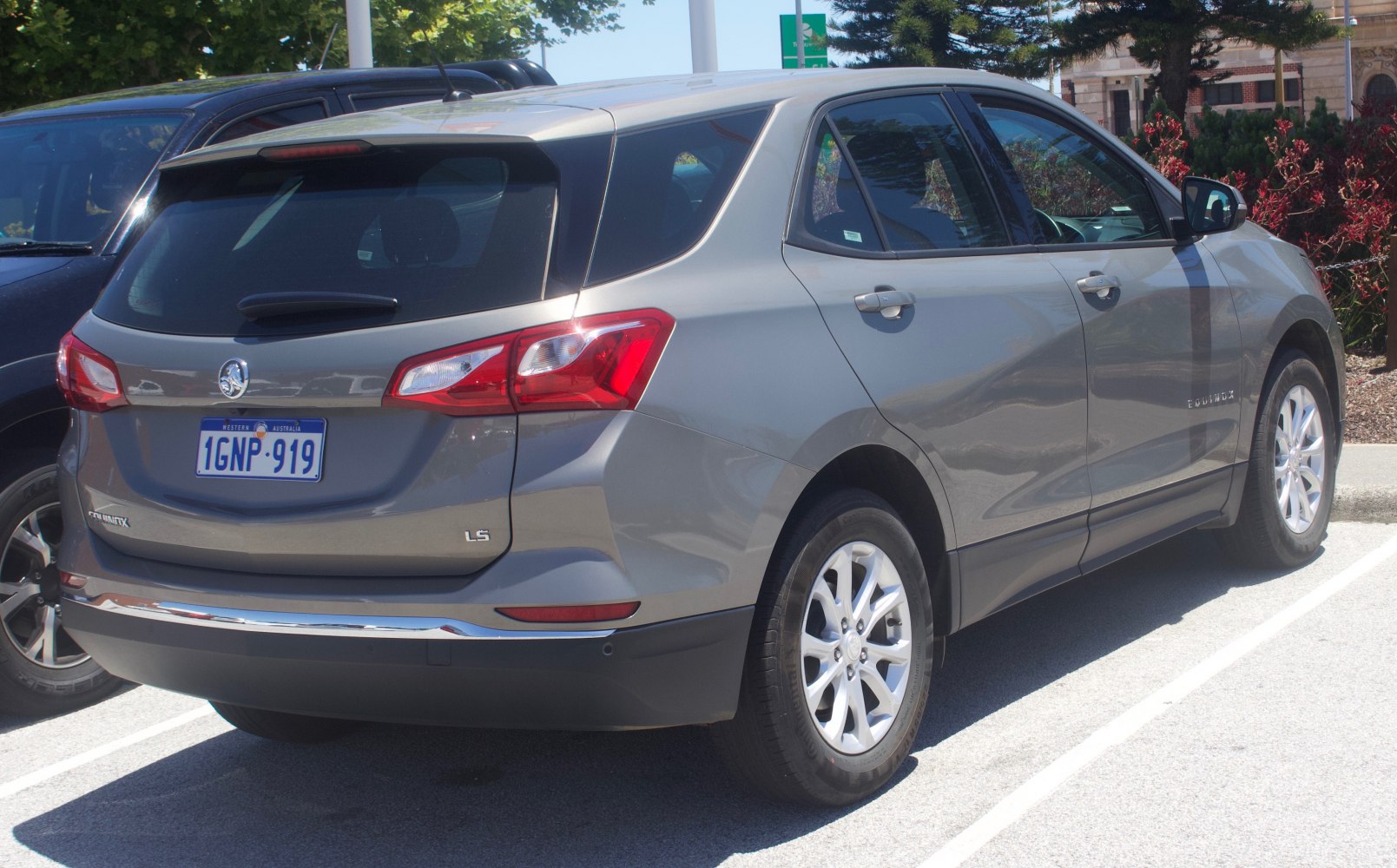 Rear and side view of mid-size SUV with distinct rear lights and chrome detail