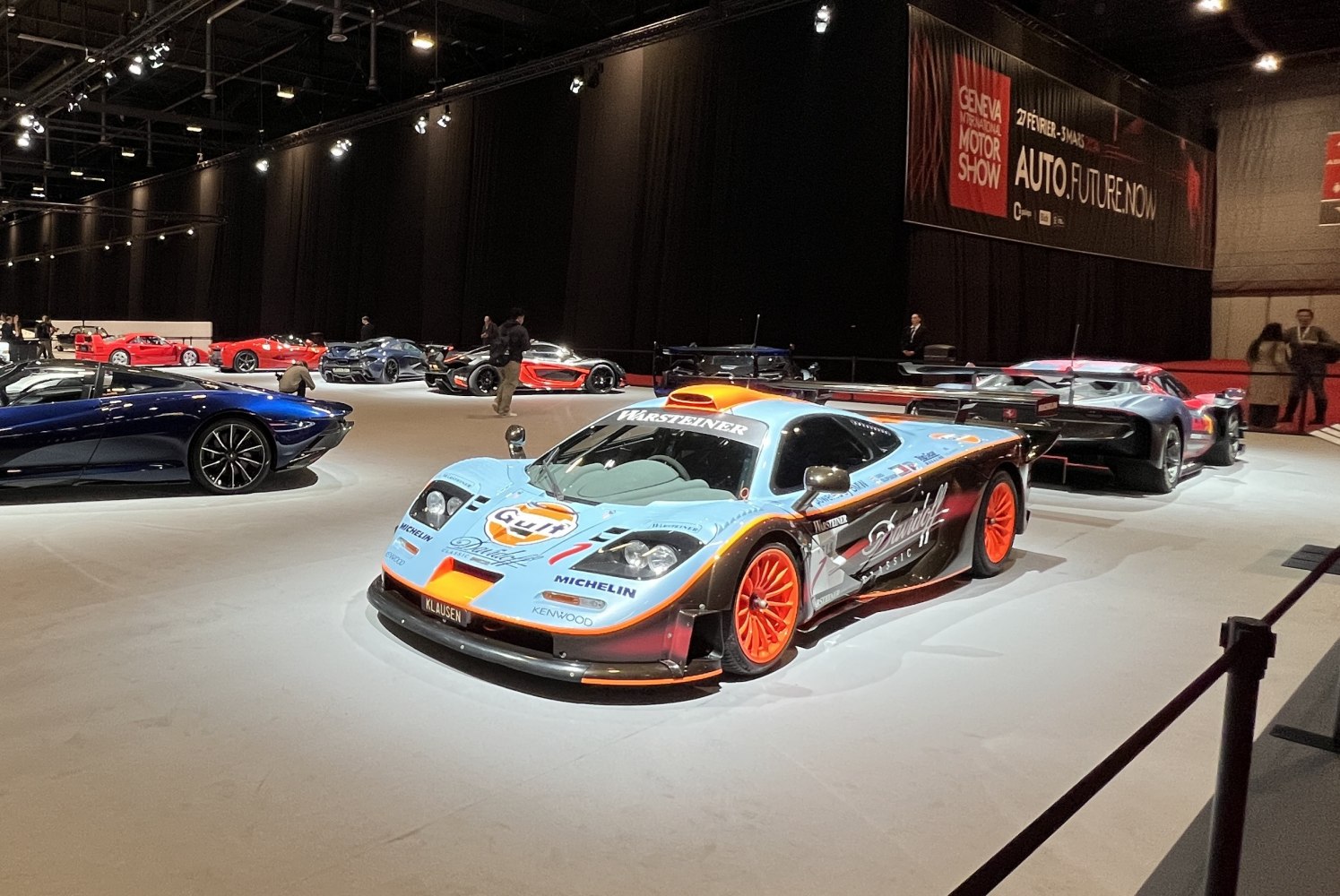 Racing livery and large rear wing with aerodynamic features